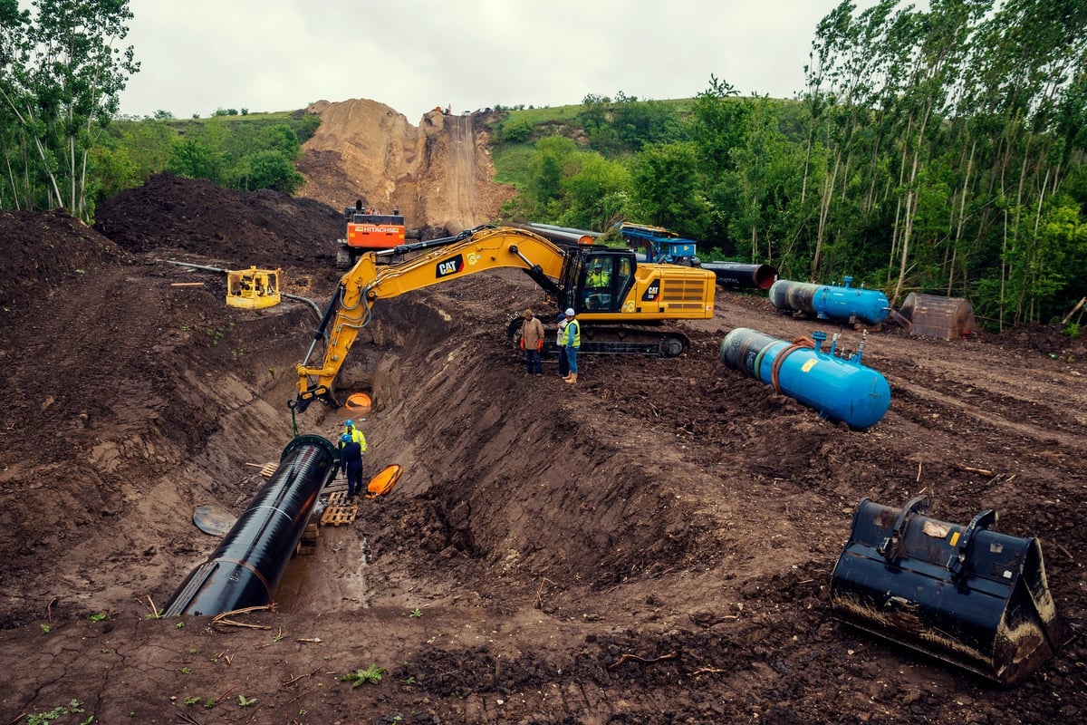 Bulgaria, Gostilia, MAY 21th, 2020: One chain excavators laying pipe in a trench during the construction of South stream pipeline in Bulgaria