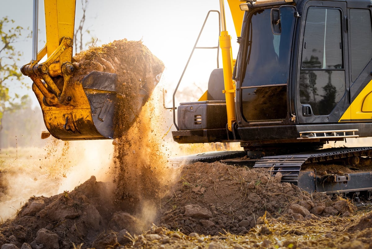 Excavator at construction site digging soil for earthwork and construction