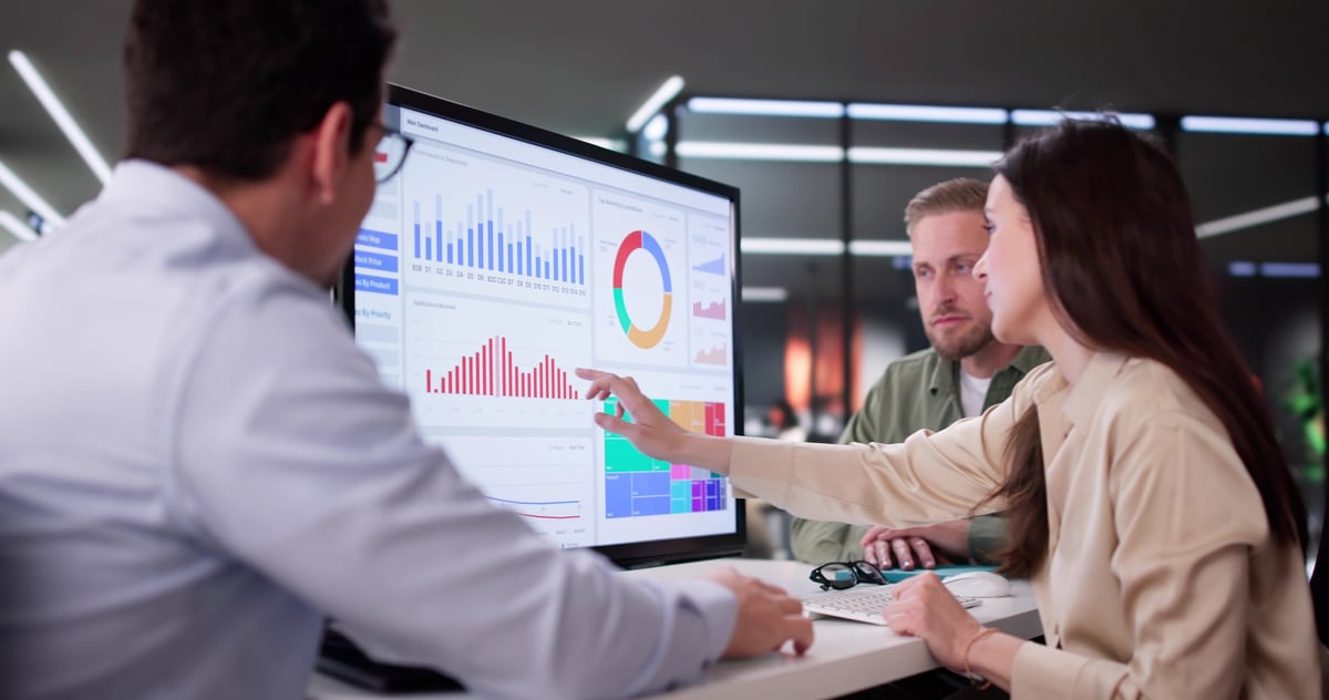 Businesswoman Managing Company Data Using Analytics Dashboard For Financial Performance