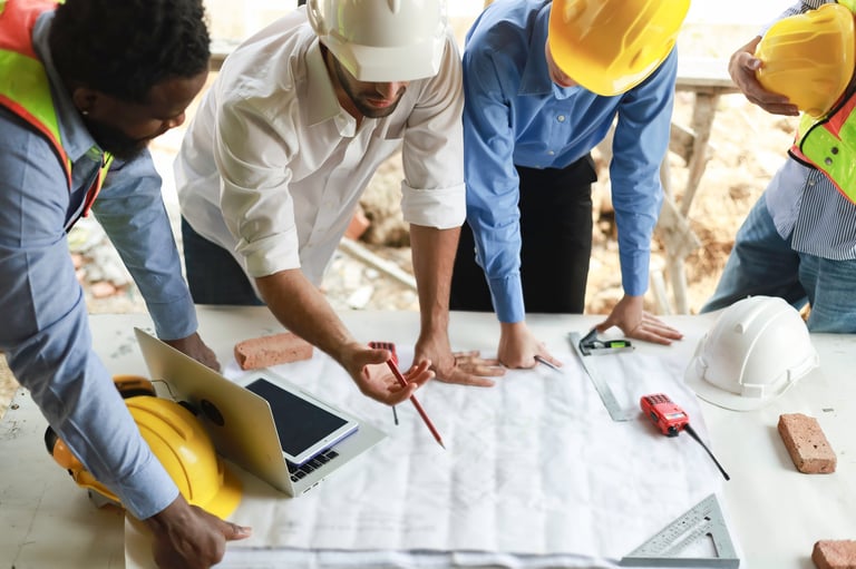 Engineers discussing progress of construction site supervision
